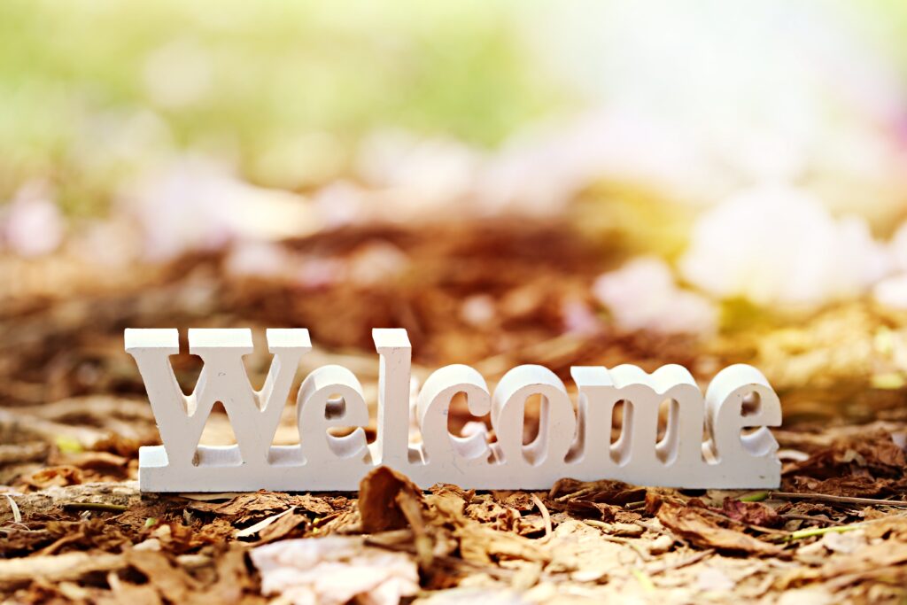 white-welcome-sign-wooden-decoration-closeup-on-gr-2021-12-02-09-37-51-utc